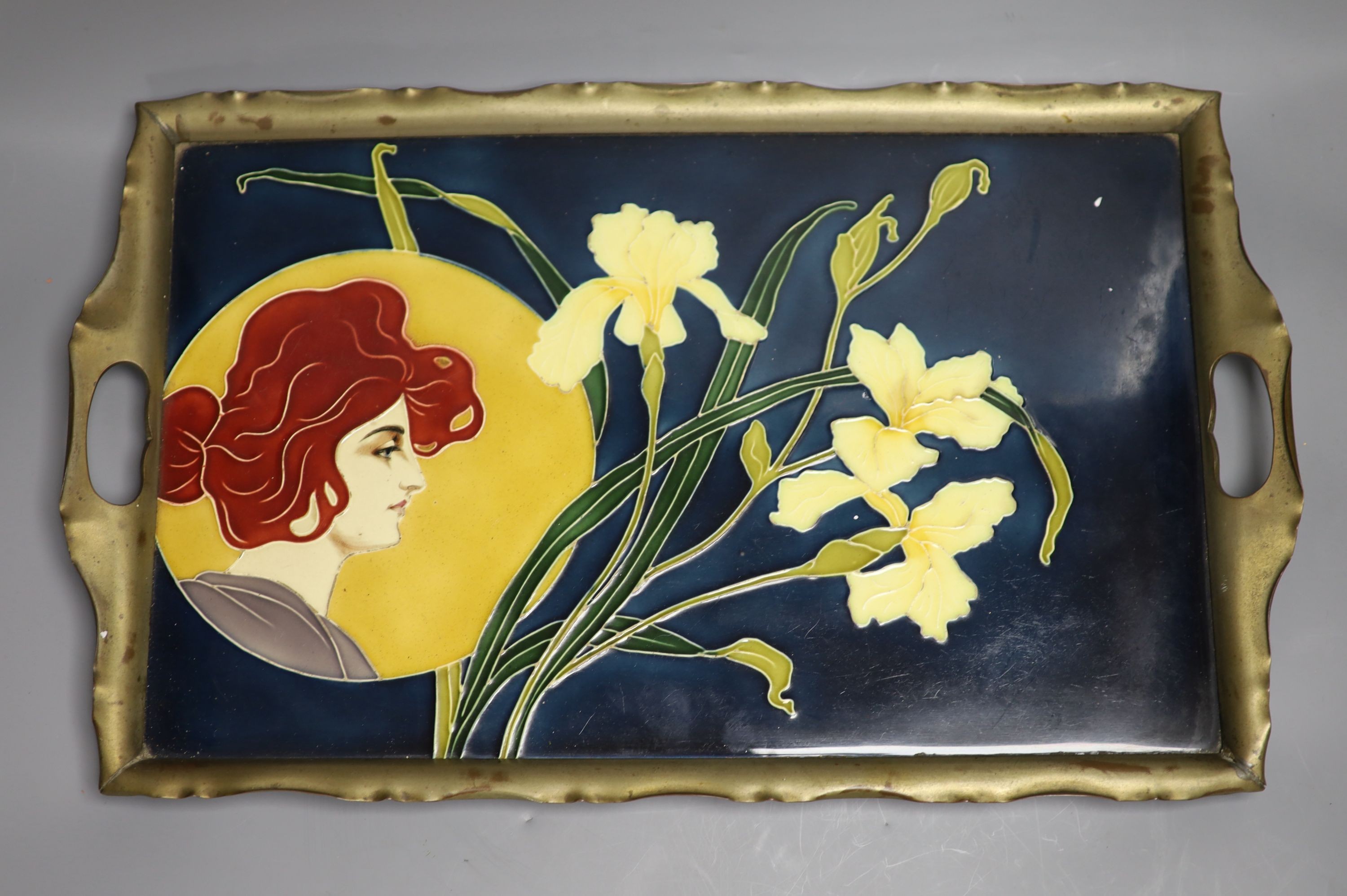 An Austrian Art Nouveau pottery and pewter mounted tray, 51cm